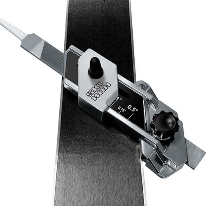 Alpine ski base bevel and side edge sharpening tool applied to skis for precise tuning and performance.